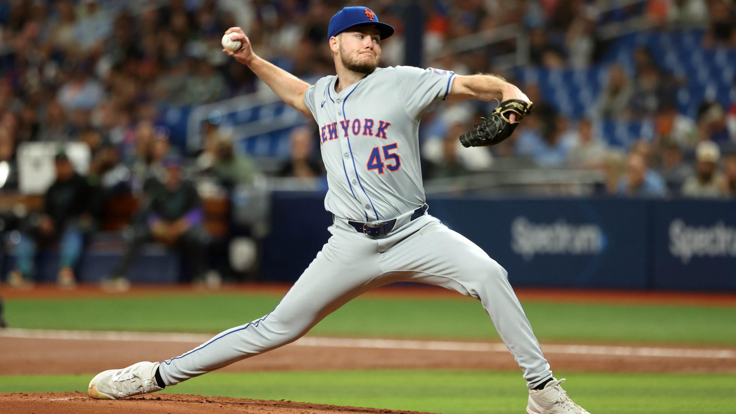 May 4, 2024; St. Petersburg, Florida, USA; New York Mets starting pitcher Christian Scott (45) throws a pitch against the Tampa Bay Rays during the first inning at Tropicana Field. / Kim Klement Neitzel-USA TODAY Sports