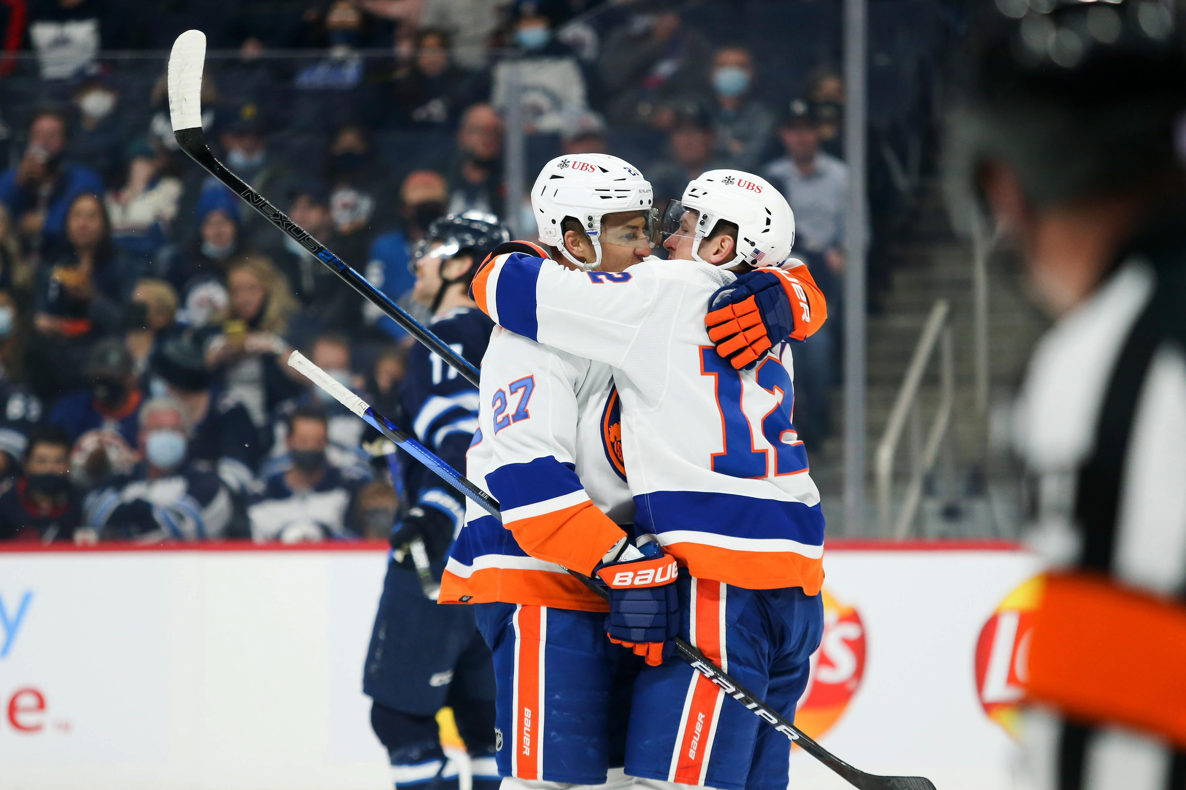 New York Islanders forward Anders Lee (27) celebrates with forward Josh Bailey (12) after scoring a goal against the Winnipeg Jets during the first period at Canada Life Centre. / Terrence Lee-USA TODAY Sports