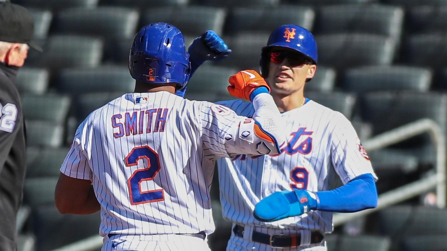 Apr 13, 2021; New York City, New York, USA; New York Mets center fielder Brandon Nimmo (9) congratulates left fielder Dominic Smith (2) after his two run home run in the first inning against the Philadelphia Phillies at Citi Field. / Wendell Cruz-USA TODAY Sports