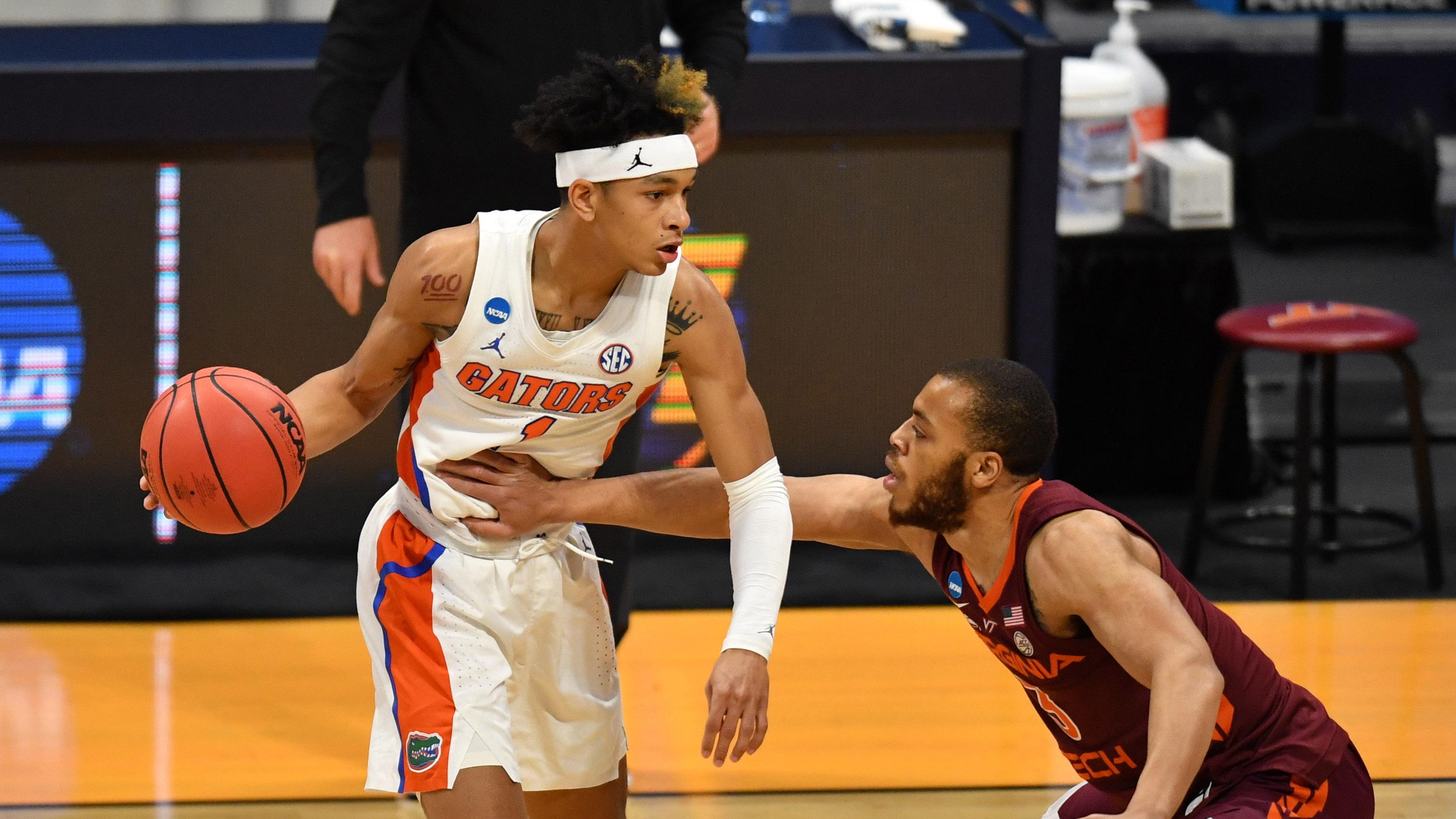 Florida Gators guard Tre Mann (1) is defended by Virginia Tech Hokies guard Wabissa Bede (3) during the first round of the 2021 NCAA Tournament at Hinkle Fieldhouse. / Patrick Gorski-USA TODAY Sports