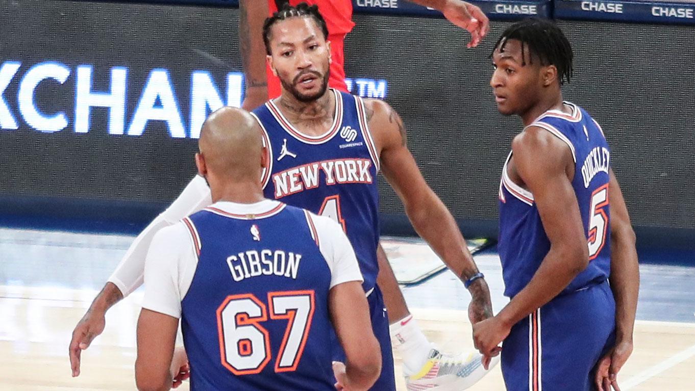 Feb 13, 2021; New York, New York, USA; New York Knicks guard Derrick Rose (4) is greeted by center Taj Gibson (67) and guard Immanuel Quickley (5) during a timeout in the second quarter against the Houston Rockets at Madison Square Garden. / Wendell Cruz-USA TODAY Sports