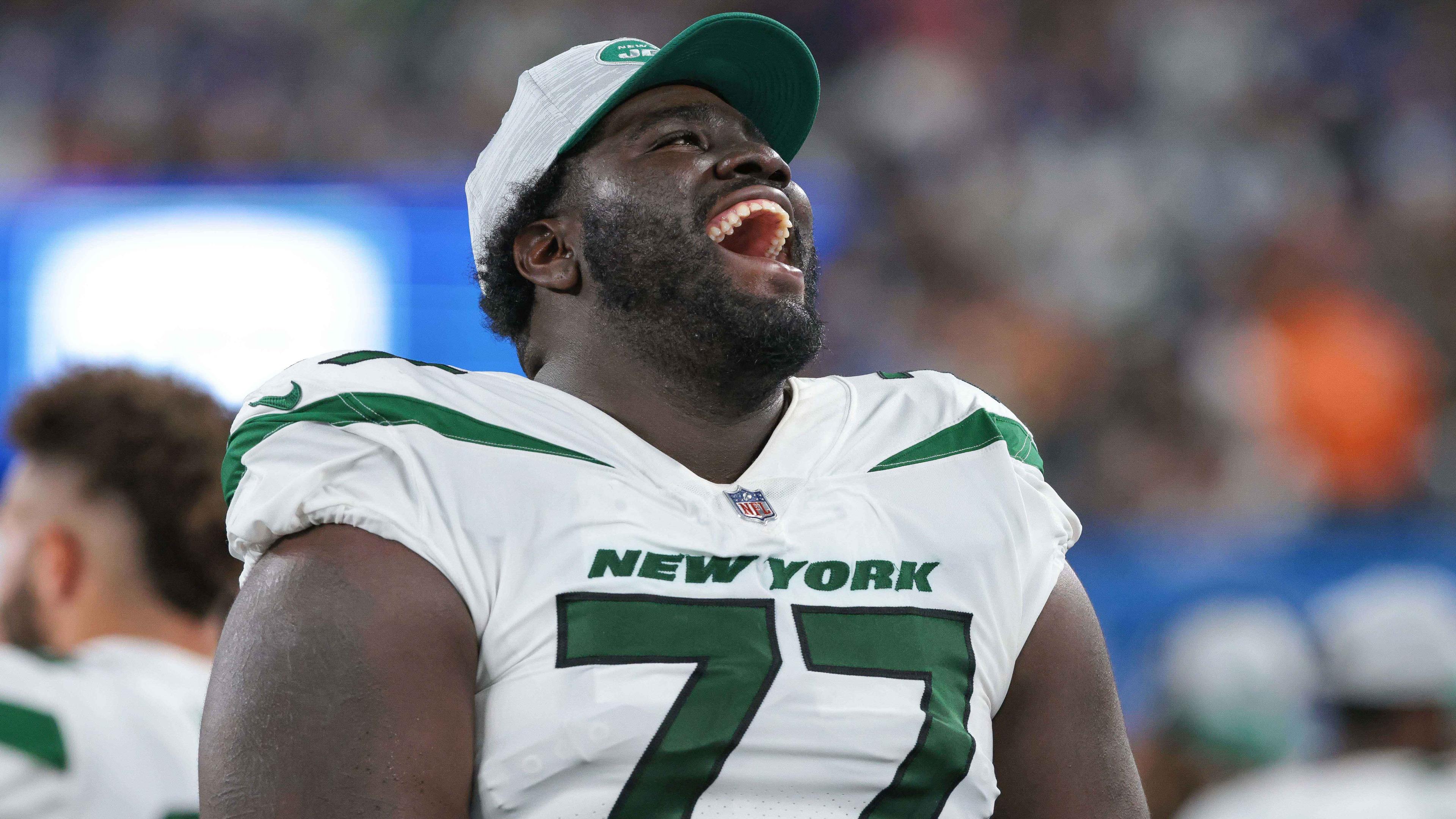 Aug 14, 2021; East Rutherford, New Jersey, USA; New York Jets offensive tackle Mekhi Becton (77) laughs during the second half against the New York Giants at MetLife Stadium. / © Vincent Carchietta-USA TODAY Sports