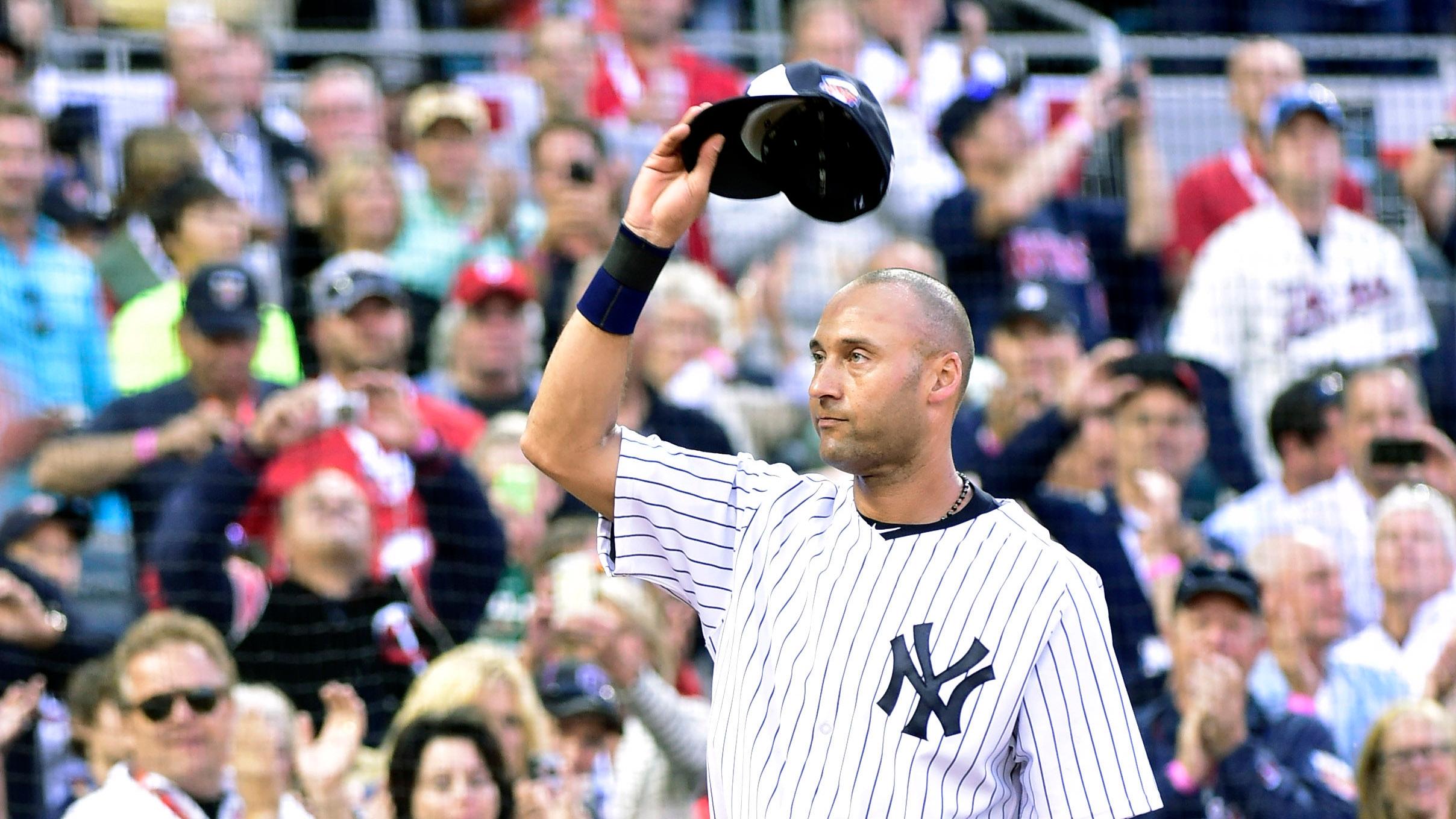 American League infielder Derek Jeter (2) of the New York Yankees waves to the crowd as he is replaced in the fourth inning during the 2014 MLB All Star Game at Target Field. / Scott Rovak - USA TODAY Sports