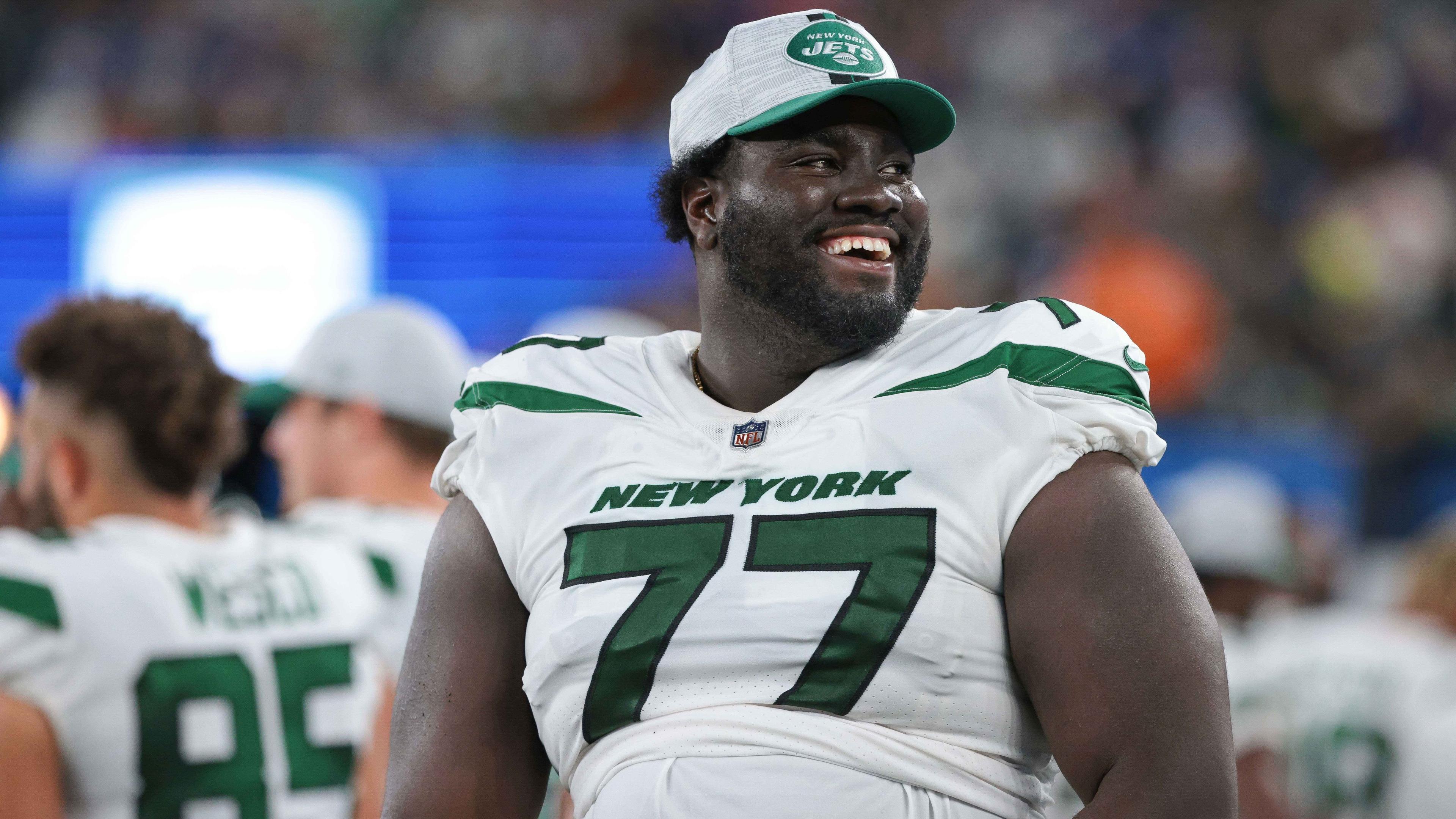 Aug 14, 2021; East Rutherford, New Jersey, USA; New York Jets offensive tackle Mekhi Becton (77) laughs during the second half against the New York Giants at MetLife Stadium. / Vincent Carchietta-USA TODAY Sports