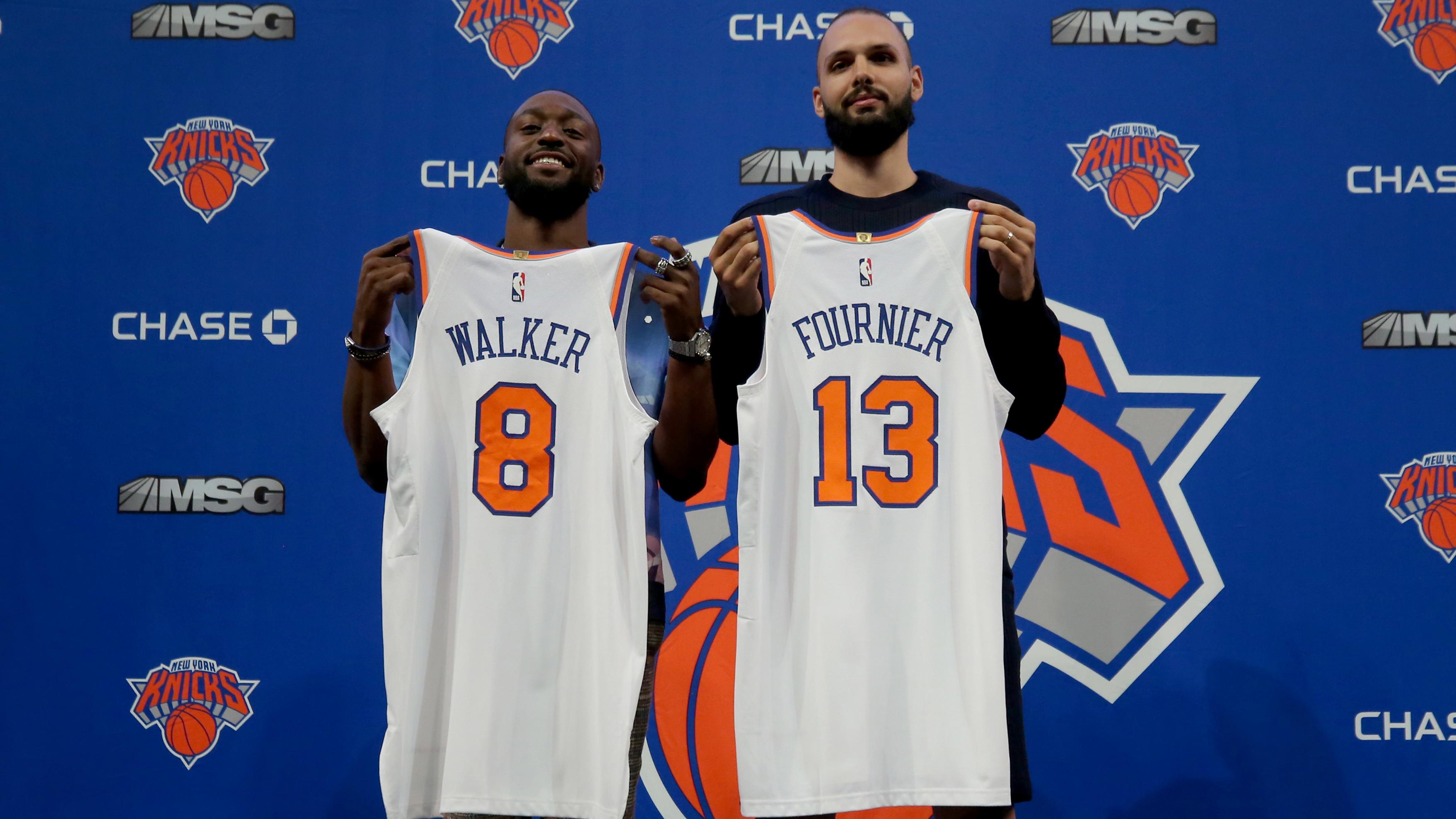 New York Knicks guards Kemba Walker (8) and Evan Fournier (13) pose for a photo during their introductory press conference at Madison Square Garden. / Brad Penner-USA TODAY Sports