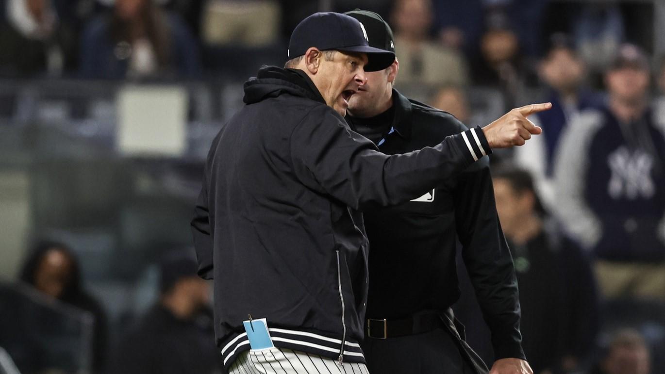 Apr 10, 2024; Bronx, New York, USA; New York Yankees manager Aaron Boone (17) argues with umpire John Bacon (70) after getting ejected in the seventh inning against the Miami Marlins at Yankee Stadium. / Wendell Cruz-USA TODAY Sports