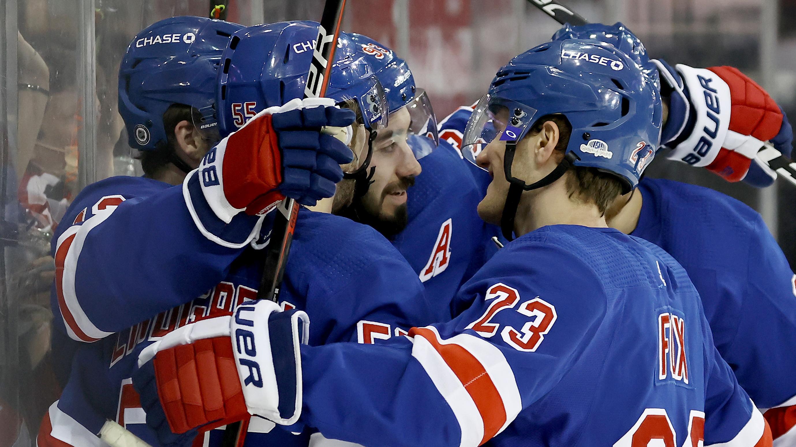 Apr 25, 2021; New York, New York, USA; Mika Zibanejad #93 of the New York Rangers is surrounded by teammates after he scored a hat trick in the second period against the Buffalo Sabres at Madison Square Garden on April 25, 2021 in New York City. / © Pool Photo-USA TODAY Sports