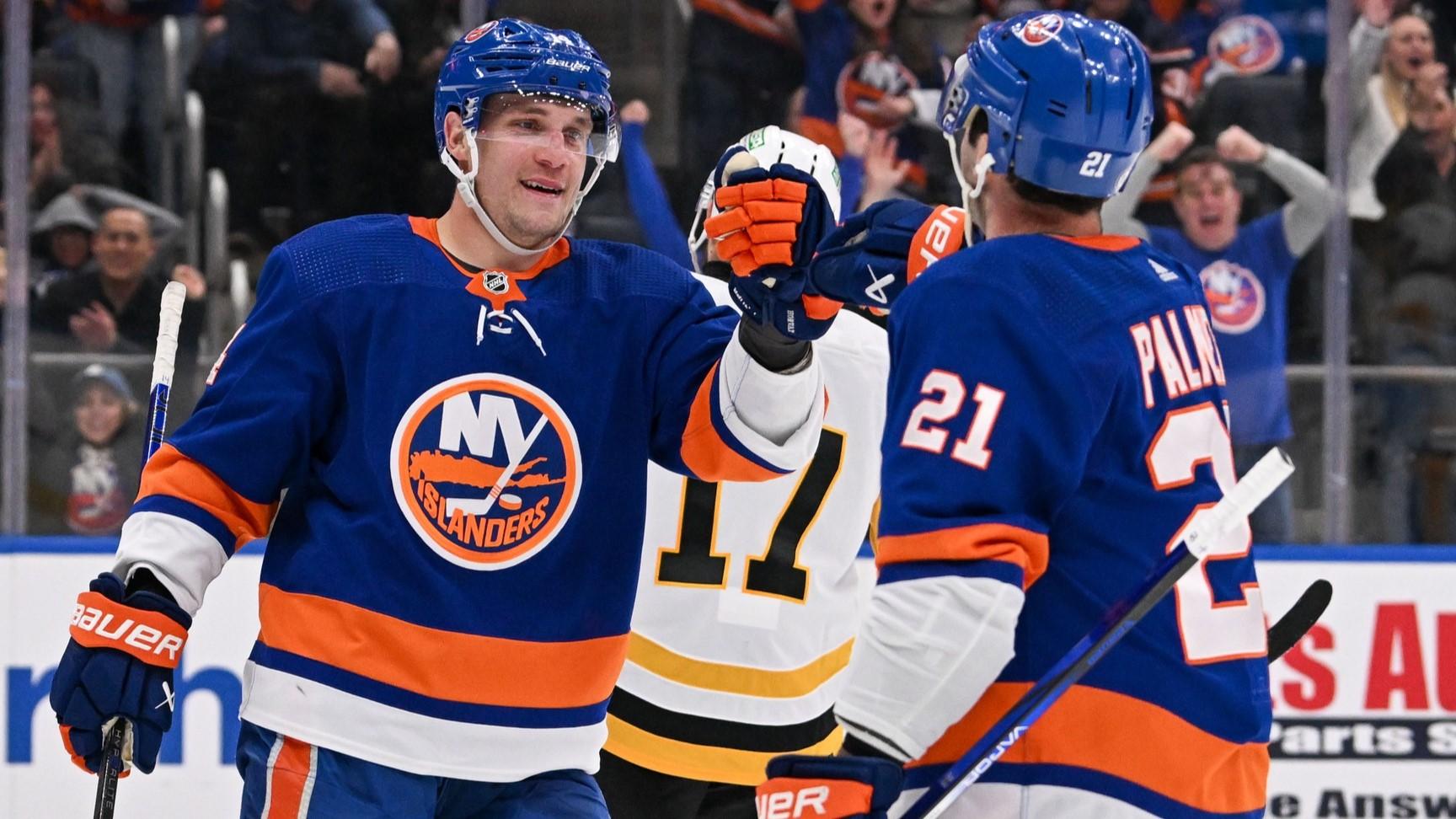 Apr 17, 2024; Elmont, New York, USA; New York Islanders center Bo Horvat (14) celebrates a goal by center Kyle Palmieri (21) against the Pittsburgh Penguins during the second period at UBS Arena. / Dennis Schneidler-USA TODAY Sports