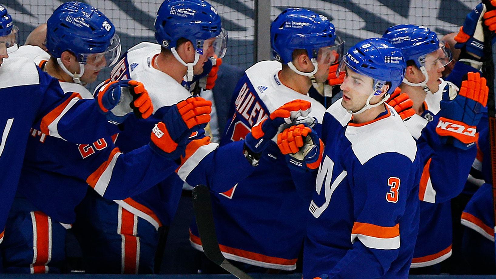 Mar 11, 2021; Uniondale, New York, USA; New York Islanders defenseman Adam Pelech (3) is congratulated after scoring a goal against the New Jersey Devils during the first period at Nassau Veterans Memorial Coliseum. / Andy Marlin-USA TODAY Sports