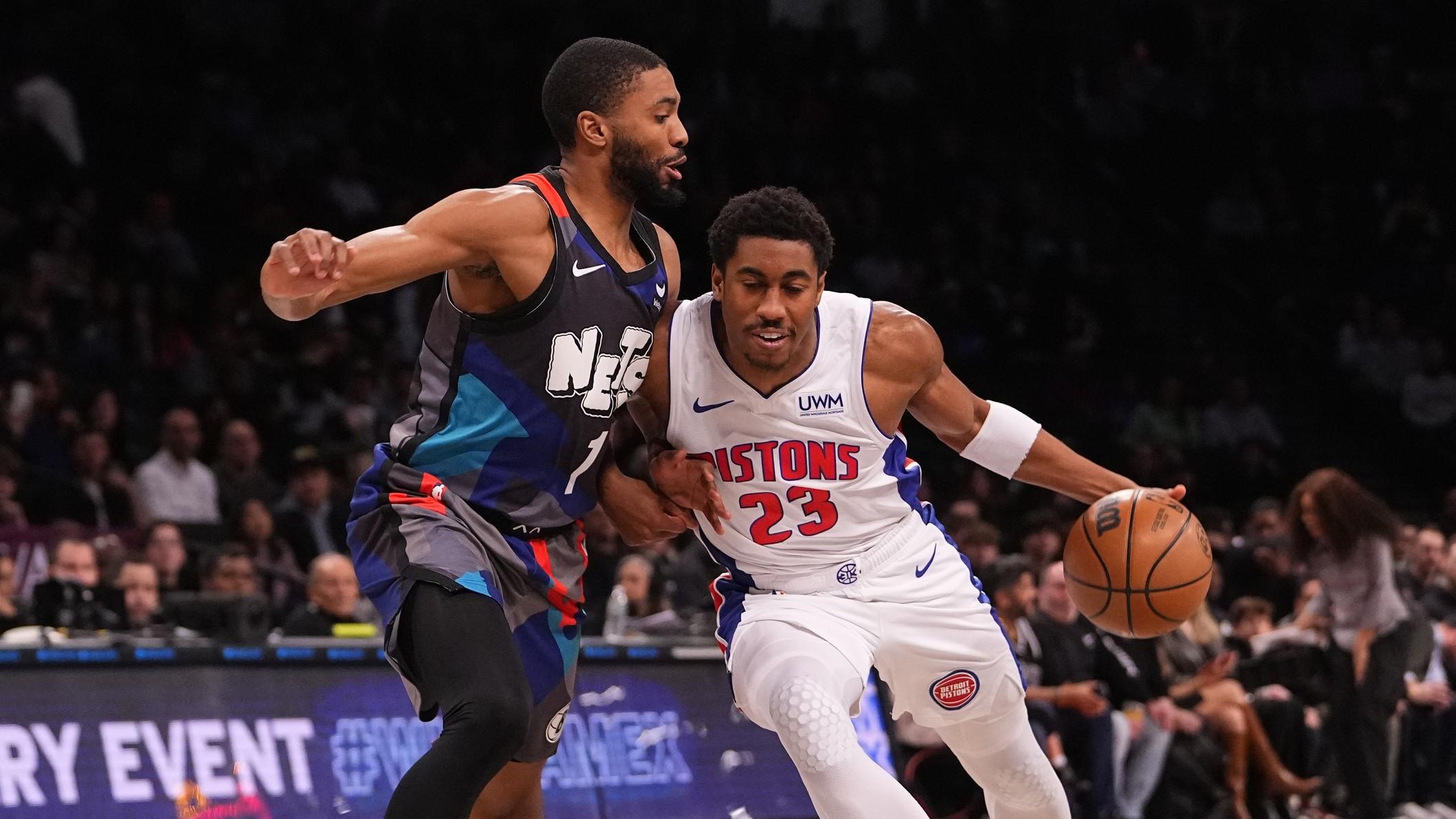 Apr 6, 2024; Brooklyn, New York, USA; Detroit Pistons point guard Jaden Ivey (23) dribbles the ball against Brooklyn Nets small forward Mikal Bridges (1) during the first half at Barclays Center. / Gregory Fisher-USA TODAY Sports