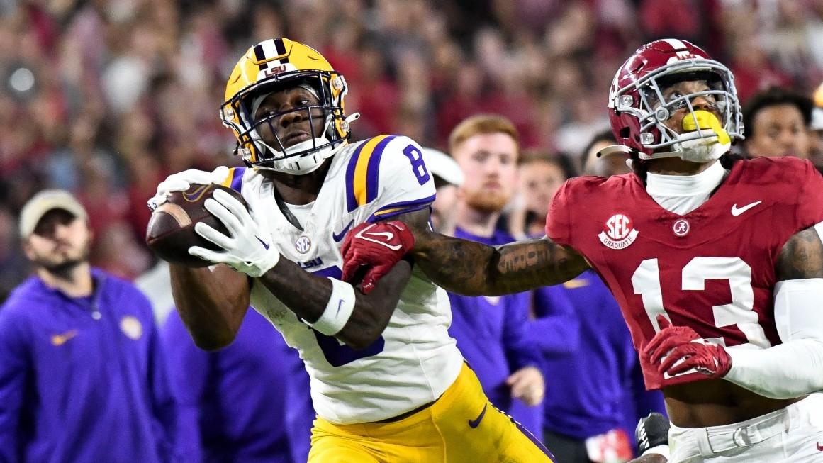 LSU Tigers wide receiver Malik Nabers (8) catches a pass as Alabama Crimson Tide defensive back Malachi Moore (13) defends at Bryant-Denny Stadium. / Gary Cosby Jr.-USA TODAY Sports