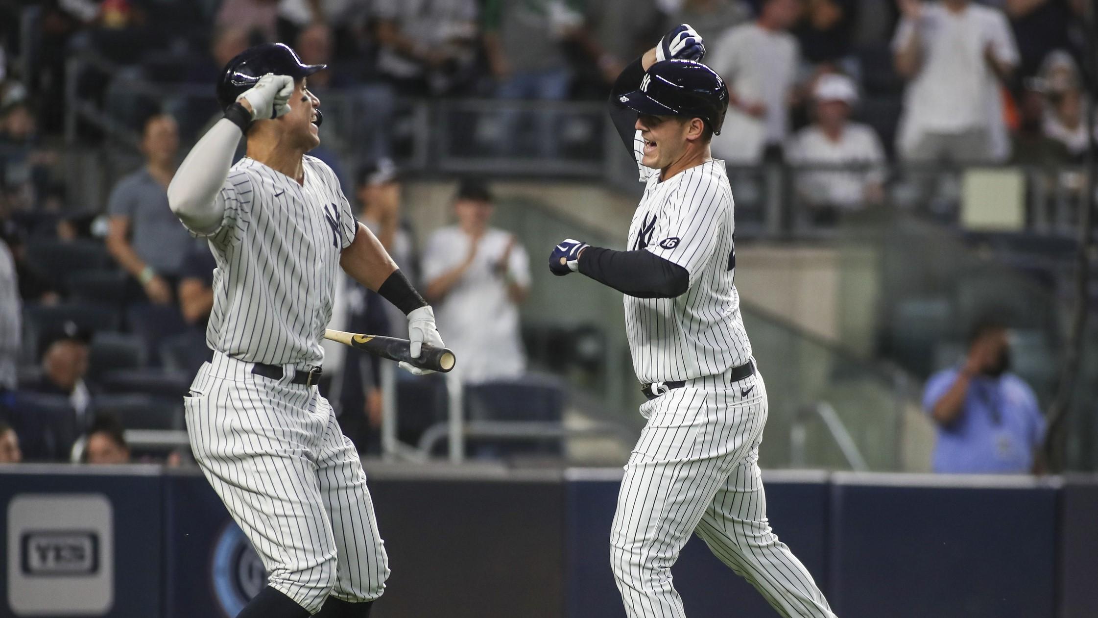 New York Yankees first baseman Anthony Rizzo (right) is greeted by right fielder Aaron Judge (left) after hitting a solo home run in the fourth inning against the Baltimore Orioles at Yankee Stadium. / Wendell Cruz-USA TODAY Sports